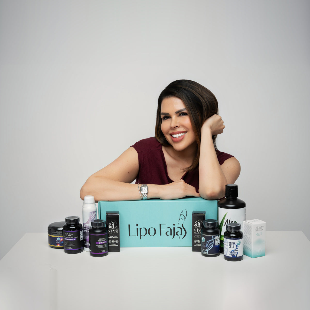 Tere, founder of Lipo Fajas, with the full product range