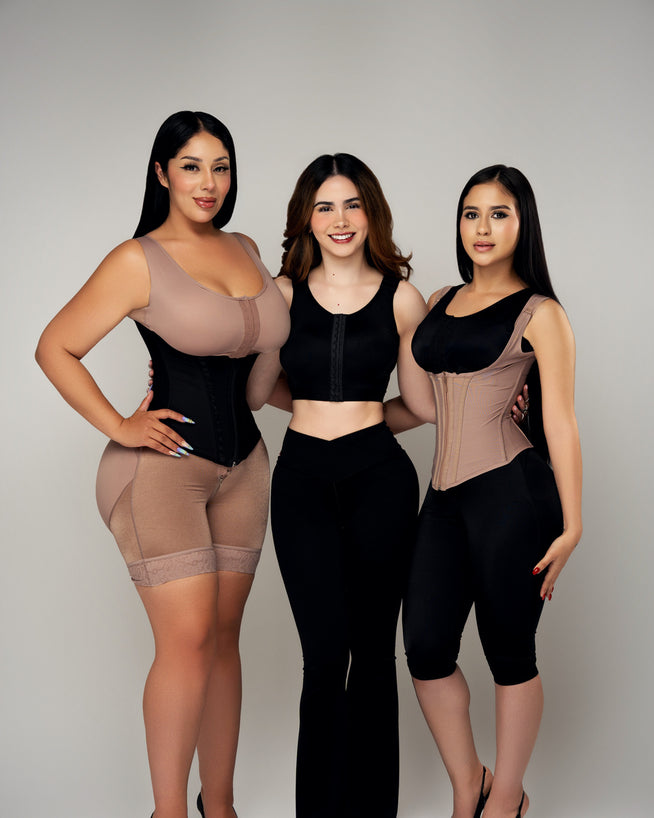 Three women wearing Lipo Fajas waist trainers and a vest over everyday clothes